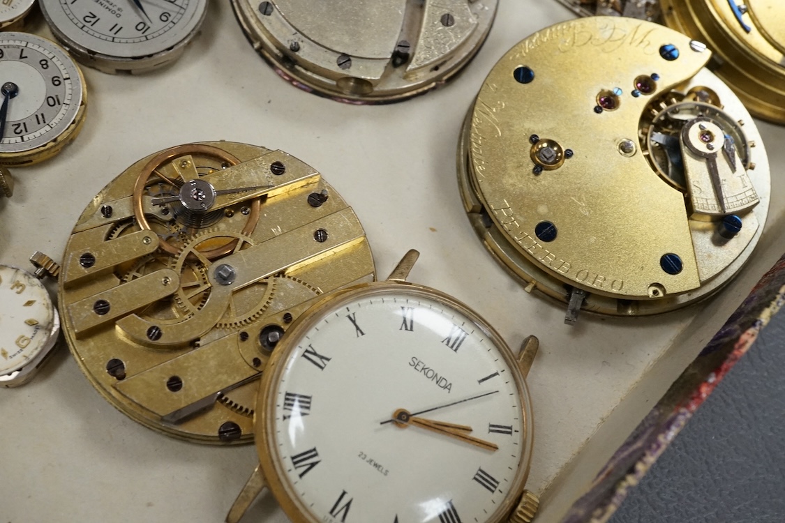 A quantity of assorted wrist and pocket watch movements, including Omega and Omega automatic, together with a pocket watch and a 935 white metal fob watch.